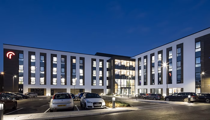 Radius corporate campus exterior with glass facade and landscaped entrance
